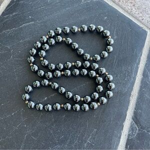 Unisex Hematite  and 14kt. Yellow gold ball 22” long no clasp Beaded Necklace